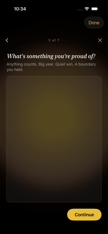 Writing prompt screen: What's something you're proud of? Empty editor with a subtle gold wash inside.